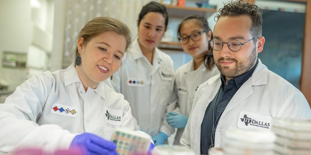 Dr. Nicole De Nisco conducts research aimed at understanding the basis for recurring urinary tract infections in postmenopausal women. In her lab, students monitor the growth of various bacteria on cell-culture dishes.