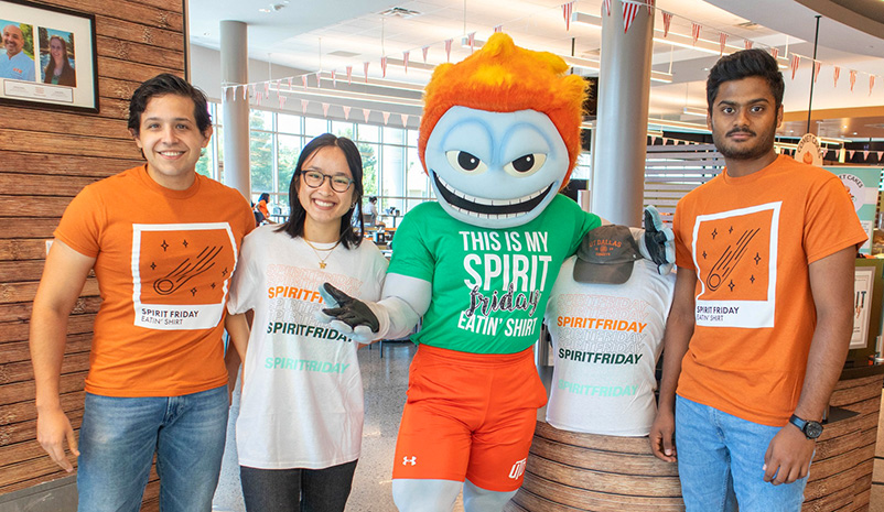 Temoc the Comet and students promoting #SpiritFriday with t-shirts.